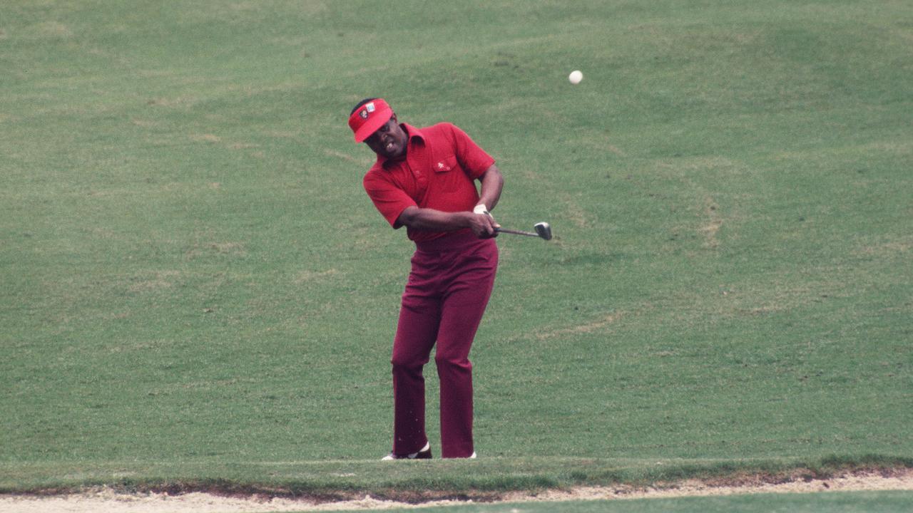 Lee Elder chips up to the green during the 1975 Masters Tournament. Photo by Augusta National/Getty Images