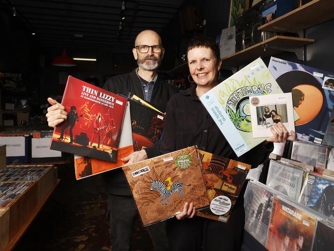 Adam MacGregor with wife Kirsty MacGregor with a selection of records to be released on the day.  Tommy Gun Records in Hobart ahead of National Record Store Day.  Picture: Nikki Davis-Jones