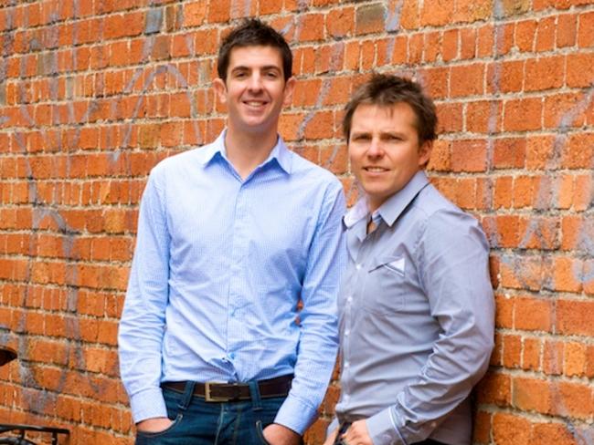 Best in business ... Sam Salter (standing, left) and Jason Wyatt, Managing Directors at The Exchange Group. Picture: News Corp Australia