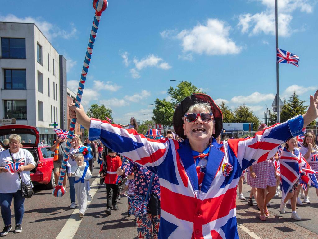 People wearing the British national colours take part in street party in Shankill, in Belfast in Northern Ireland. Picture: AFP