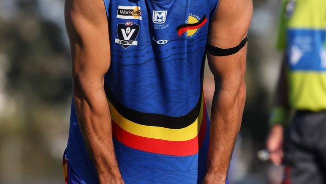 Former AFL star Eddie Betts manages a laugh even though his side Rumbalara went down to Deniliquin by 65pts in the Murray Football League game at Shepparton. Picture: Ian Currie