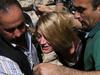 Lebanese policemen surround Australian TV presenter Tara Brown while escorting her from a Lebanese courthouse to Baabda Prison for women, in Baabda east of Beirut, on April 18, 2016. A joint Australian-Lebanese commission has been set up to examine a controversial child abduction case in which several Australian nationals have been charged, Lebanon's top diplomat announced. Lebanese authorities charged Australian mother Sally Faulkner and four employees of Australia's Channel Nine television over the abduction of her two children last week. / AFP PHOTO / MARWAN TAHTAH