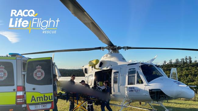 File photo of a LifeFlight rescue chopper and Queensland ambulance.