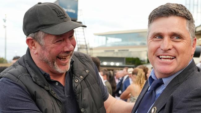 Brett Ratten (left) just made it to The Valley to watch the Moir Stakes with Shane Crawford (right). Picture: George Salpigtidis—Racing Photos via Getty Images.