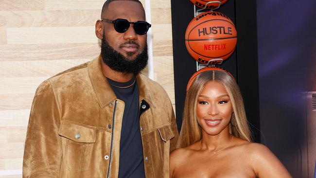 US basketball player LeBron James and his wife Savannah Brinson James arrive for Netflix's Los Angeles premiere of "Hustle" held at the Westwood Regency Village Theatre on June 1, 2022 in Los Angeles, California. (Photo by Michael Tran / AFP)