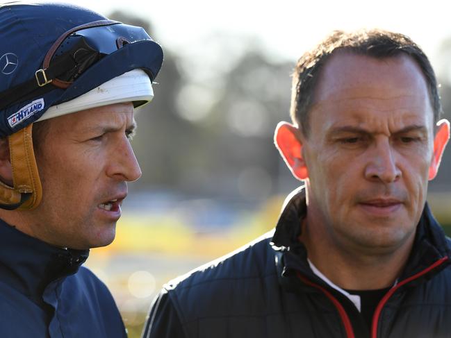 Jockey Hugh Bowman (left) and trainer Chris Waller (right) speak to the media following a Winx's barrier trial at Rosehill Gardens Racecourse in Sydney, Tuesday, August 7, 2018. (AAP Image/Dean Lewins) NO ARCHIVING