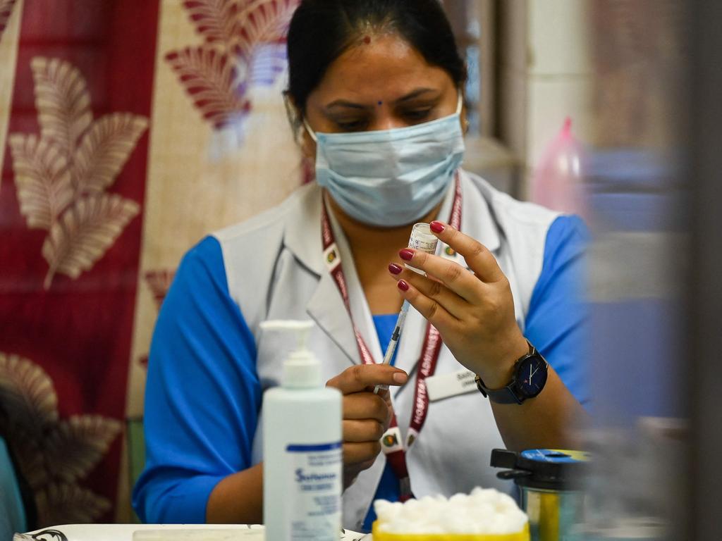 A health worker inoculates prepares a dose of the Covaxin vaccine against the Covid-19 at a health centre in New Delhi. Picture: AFP