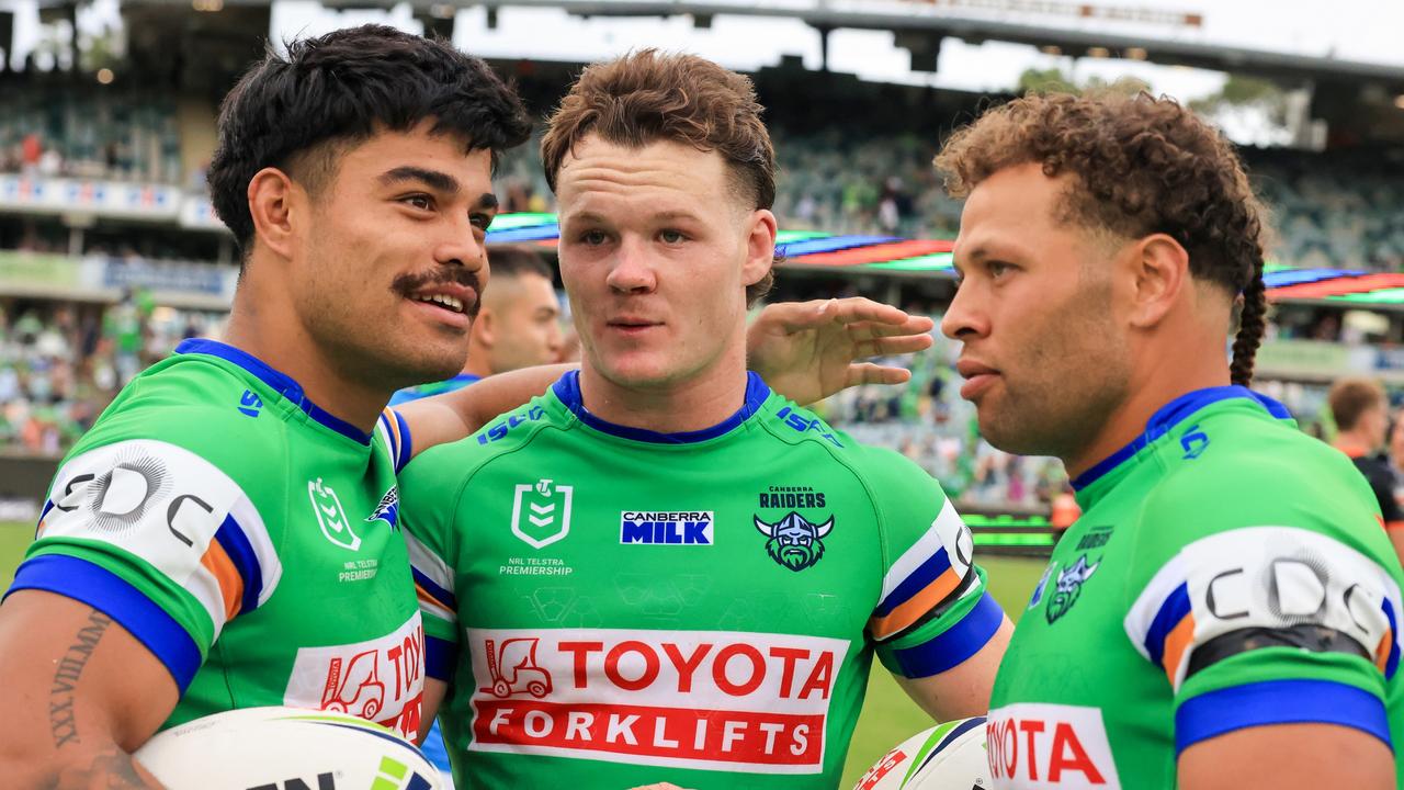 CANBERRA, AUSTRALIA - MARCH 16: Matthew Timoko of the Raiders, Ethan Strange of the Raiders and Sebastian Kris of the Raiders celebrate their win during the round two NRL match between Canberra Raiders and Wests Tigers at GIO Stadium, on March 16, 2024, in Canberra, Australia. (Photo by Jenny Evans/Getty Images)