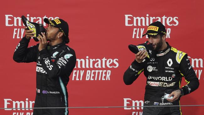 Daniel Ricciardo (R) enjoys a shoey after making the podium in Italy. Picture: Luca Bruno/Getty