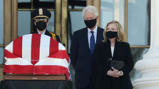 Former U.S. President Bill Clinton and former Secretary of State Hillary Clinton pay their respects to Associate Justice Ruth Bader Ginsburg as her flag-draped casket is displayed on the west front of the US Supreme Court. Picture: Chip Somodevilla/Getty Images/AFP