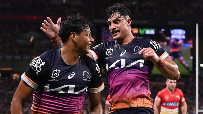 BRISBANE, AUSTRALIA - MARCH 24: Selwyn Cobbo (L) of the Broncos celebrates scoring a try with Kotoni Staggs during the round four NRL match between the Dolphins and Brisbane Broncos at Suncorp Stadium on March 24, 2023 in Brisbane, Australia. (Photo by Bradley Kanaris/Getty Images)