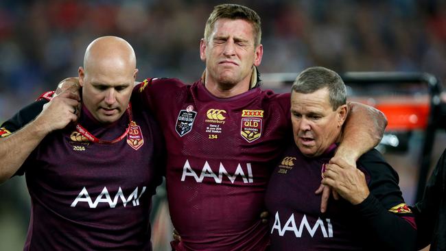 QLD's Brent Tate helped off injured during Game 2 of the 2014 State of Origin series at ANZ Stadium. Picture: Gregg Porteous