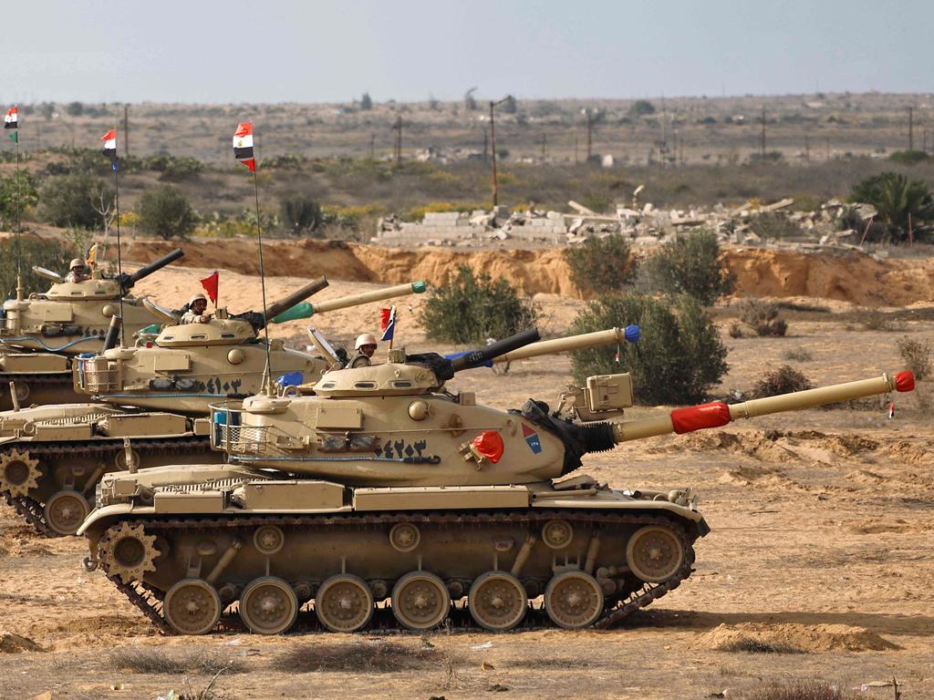 Egyptian tanks are deployed near Egypt's northern Rafah border crossing with Gaza. Picture: AFP