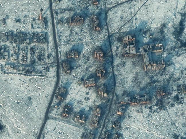 CORRECTION / This handout satellite image taken and released on January 10, 2023 by Maxar Technologies shows the the destroyed schools and buildings in southern Soledar, near Bakhmut in eastern Ukraine. - Ukrainian President Volodymyr Zelensky said on January 11 fighting was still raging in a key eastern frontline city that a Russian mercenary group earlier said it controlled. The fate of Soledar in eastern Ukraine was uncertain after Russian group Wagner claimed it controlled the gateway town -- but the Kremlin cautioned against declaring victory prematurely. (Photo by Handout / Satellite image Â©2022 Maxar Technologies / AFP) / RESTRICTED TO EDITORIAL USE - MANDATORY CREDIT "AFP PHOTO / Satellite image Â©2022 Maxar Technologies" - NO MARKETING NO ADVERTISING CAMPAIGNS - DISTRIBUTED AS A SERVICE TO CLIENTS / âThe erroneous mention[s] appearing in the metadata of this photo by Handout has been modified in AFP systems in the following manner: [January 10, 2023] instead of [January 11, 2023]. Please immediately remove the erroneous mention[s] from all your online services and delete it (them) from your servers. If you have been authorized by AFP to distribute it (them) to third parties, please ensure that the same actions are carried out by them. Failure to promptly comply with these instructions will entail liability on your part for any continued or post notification usage. Therefore we thank you very much for all your attention and prompt action. We are sorry for the inconvenience this notification may cause and remain at your disposal for any further information you may require.â