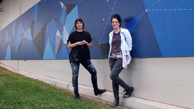 Province Studio artists s Anne-Louise Dadak and Laura Pike with their mural Constellations at Bankstown Arts Centre for the Night Sky project.