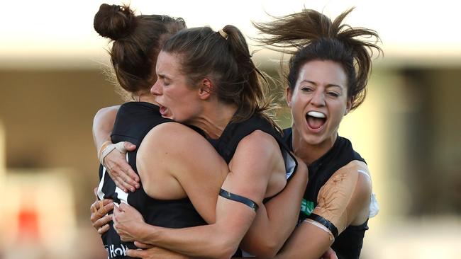 Alicia Eva (centre) has left Collingwood. (Photo by Michael Willson/AFL Media/Getty Images)