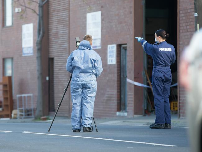 Forensic officers investigate. Picture: Sarah Matray