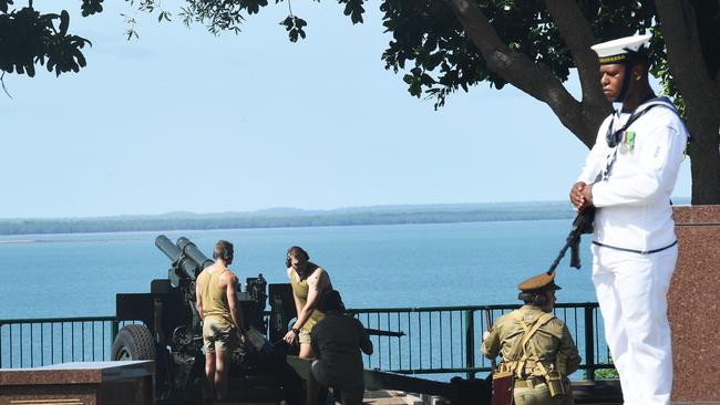 Soldiers from the 8/2 Regiment fire M2A2 Howitzers during the service commemorating the anniversary of Bombing of Darwin. Picture Katrina Bridgeford.