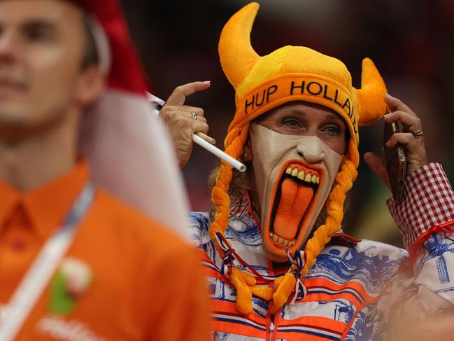 A Netherlands' supporter wearing a mask looks on before the start of the match. Picture: Adrian Dennis/AFP