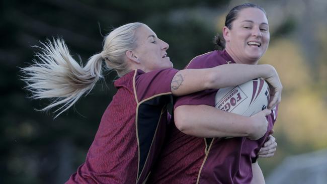 Queensland Jillaroos squad members Steph Hancock (ball) and Ali Brigginshaw. Picture: AAP