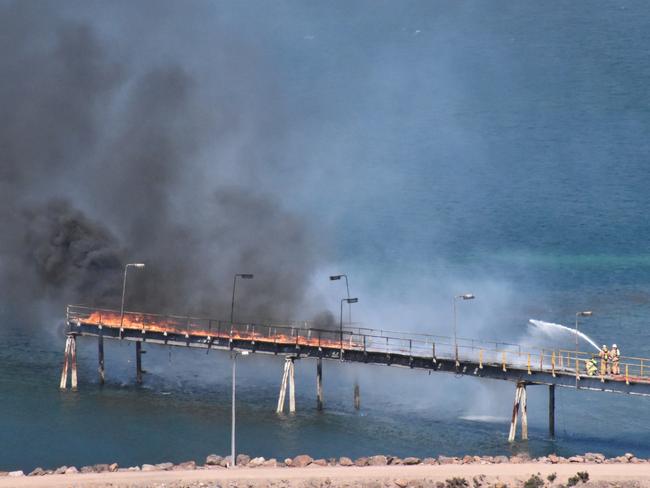 Firefighters put out the blaze on the Whyalla jetty. Picture: Whyalla Council