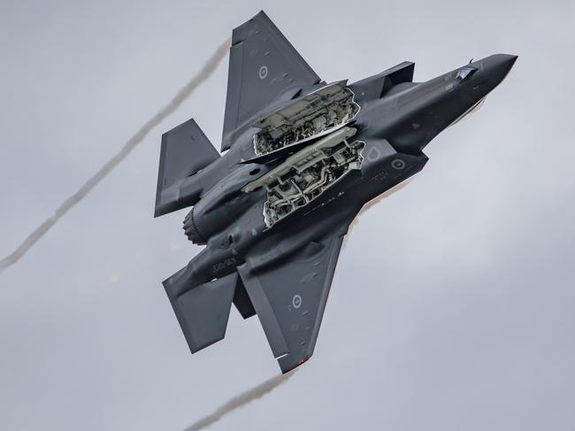 F-35A Lightning II, A35-023 puts on an aerial display at the No. 81 Wing Family Day at RAAF Base Williamtown.  *** Local Caption *** Royal Australian Air Force No 81 Wing and Numbers 2OCU, 3 and 77 Squadrons held a Family Day at RAAF Base Williamtown on Friday 16 April 2021. The family members 81 Wing personnel were invited to visit the base and squadrons, presenting a special insight into their family memberâs role and work environment. The event included static displays of an F-35A Lightning II fighters and an F-35A Lightning II Hawk flying display.