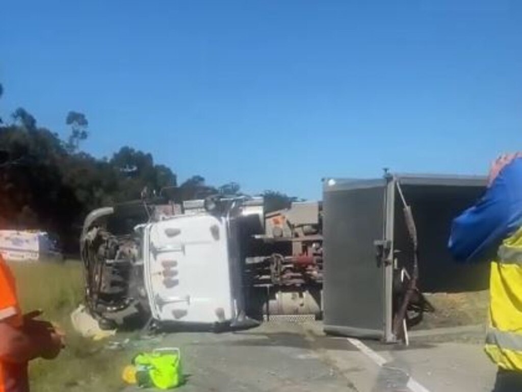 One of the two trucks that has rolled following a crash on the M1 at Pimpama. Picture 7 News