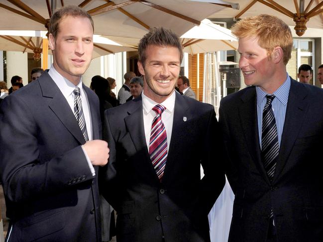 David Beckham, with Prince William and Prince Harry, has long been part of the royal circle. Picture: AP