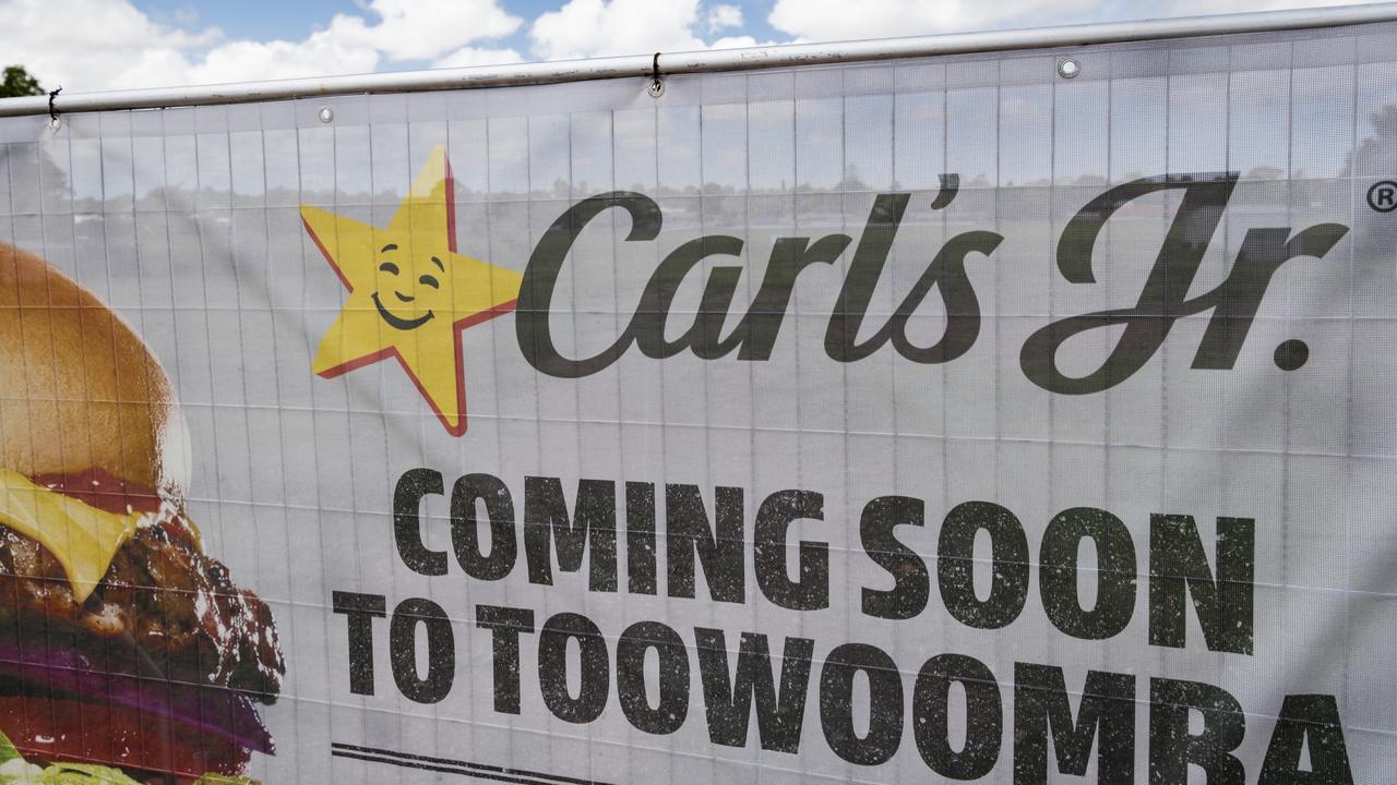 A sign on a Bridge St construction site advertising Carl's Jr is coming to Toowoomba, Thursday, January 11, 2024. Picture: Kevin Farmer