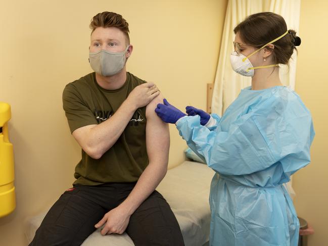 Jackson Gray, 21, receives his first AstraZeneca vaccination from Dr Phoebe Norville in Campbelltown on Thursday, 29 July, 2021. Picture: Nikki Short