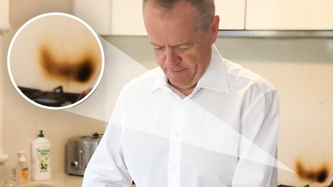 Bill Shorten in the kitchen making school lunches with a serious burn mark on the wall. Picture: Twitter