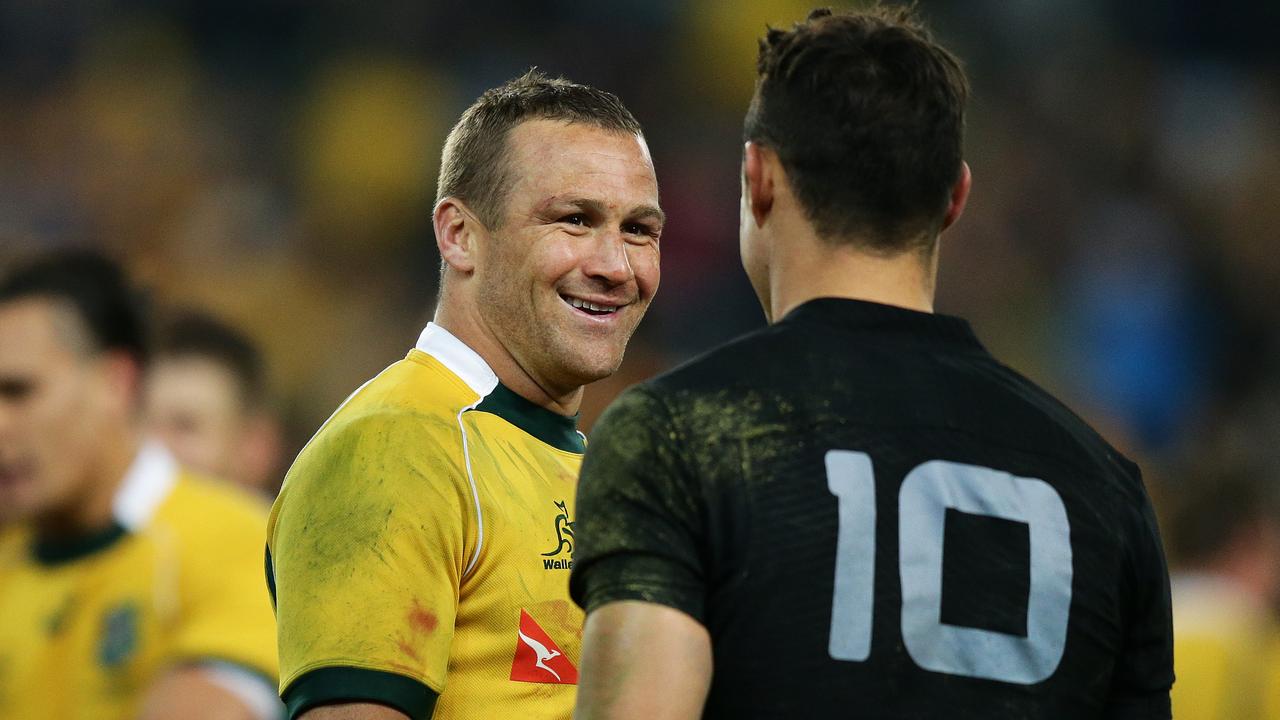 Wallabies star Matt Giteau with All Blacks rival Dan Carter at ANZ Stadium, Sydney.