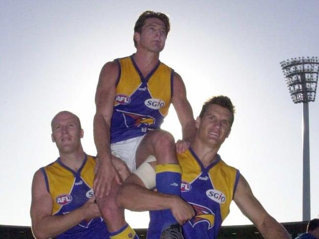 SPORT   Digital Image   AFL Football at Subiaco Oval   Fremantle Dockers vs West Coast Eagles   Derby   Ben Cousins is chaired off of Subiaco Oval by veteran team mates Ashley McIntosh and Glen Jakovich after playing his 150th game   Picture: JACKSON FLINDELL