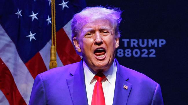 (FILES) In this file photo taken on March 13, 2023, former US President Donald Trump arrives for an event at the Adler Theatre in Davenport, Iowa. - Senior Republicans on March 19, 2023, echoed Donald Trump's claim that a looming indictment in a hush-money case would amount to political "persecution," while Democrats warned his call for protests could trigger a repeat of chaos his supporters unleashed at the US Capitol. (Photo by KAMIL KRZACZYNSKI / AFP)