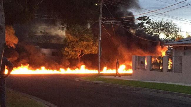 A fire blazed down the street after the fatal landing. Picture: 7 News