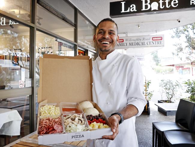 Chef and Owner of La Botte Pizzeria Shipon Shazadul with the Willoughby restaurant’s takeaway pizza kits. Picture: Tim Hunter.