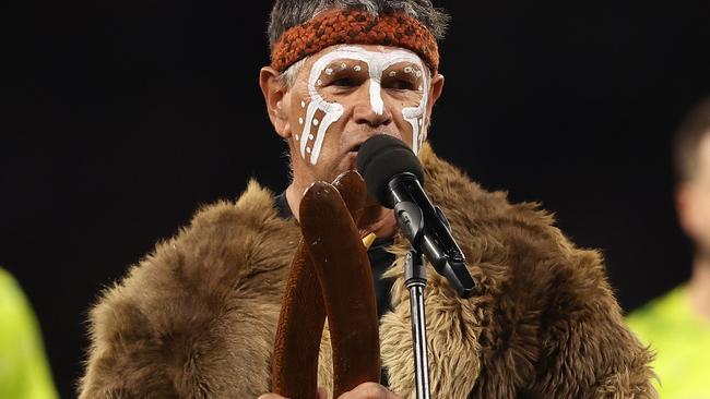 PERTH, AUSTRALIA - MAY 24: Dr Richard Walley performs the welcome to country during the round 11 AFL match between Walyalup (the Fremantle Dockers) and Collingwood Magpies at Optus Stadium, on May 24, 2024, in Perth, Australia. (Photo by Paul Kane/Getty Images)