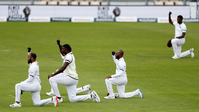 Players takes a knee in support of the Black Lives Matter movement on the first day of the first Test between England and the West Indies in July