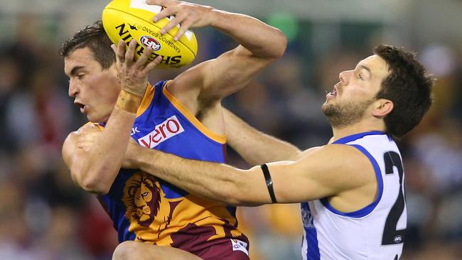 Tom Rockliff marks in front of Levi Greenwood.