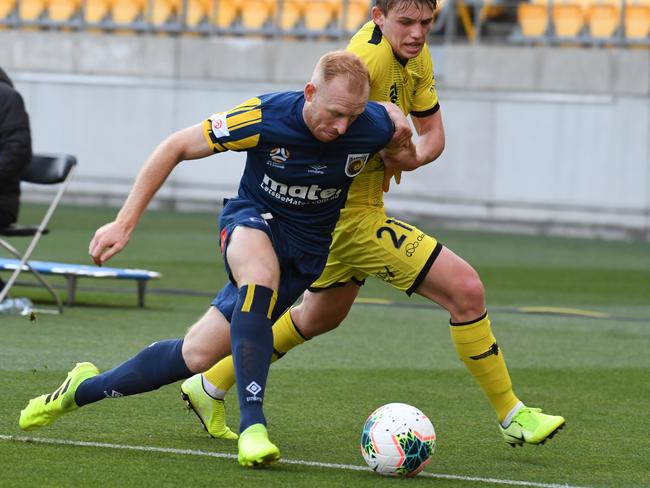 Mariners fullback Ziggy Gordon of the Mariners (front) and Callum McCowatt of the Phoenix contest the ball. Picture: AAP