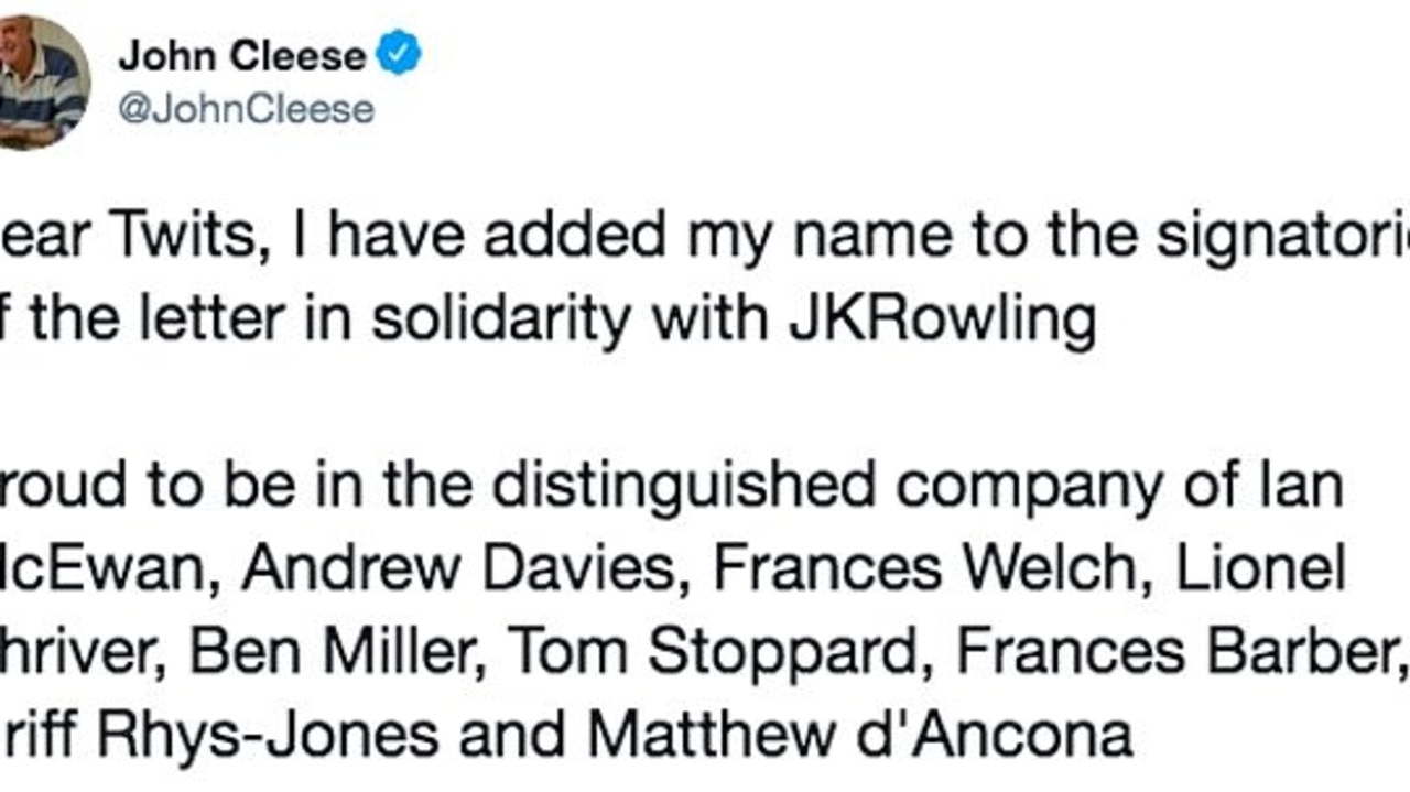 Monty Python star John Cleese stands with J.K. Rowling.