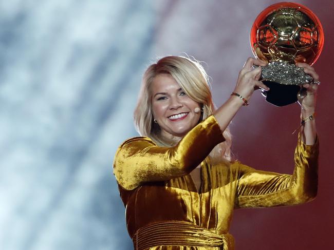 FILE - In this Dec. 3, 2018, file photo, Olympique Lyonnais soccer player Ada Hegerberg celebrates with the Women's Ballon d'Or award during the Golden Ball award ceremony at the Grand Palais in Paris, France. The worldâ€™s best player wonâ€™t be at the Womenâ€™s World Cup. Hegerberg stepped away in 2017 because of what she perceives to be a general disregard for womenâ€™s soccer by the countryâ€™s federation. (AP Photo/Christophe Ena, File)