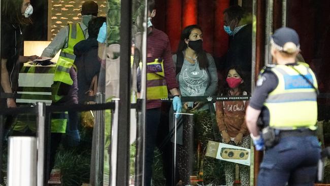 Some of Melbourne’s first overseas travellers arrive at the Crown Promenade quarantine hotel in late March. Picture: AAP Image/Scott Barbour