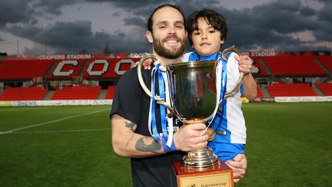 Adelaide Olympic captain Ricardo Da Silva and son following his side’s FFA Cup SA final victory. Picture: AAP/Emma Brasier