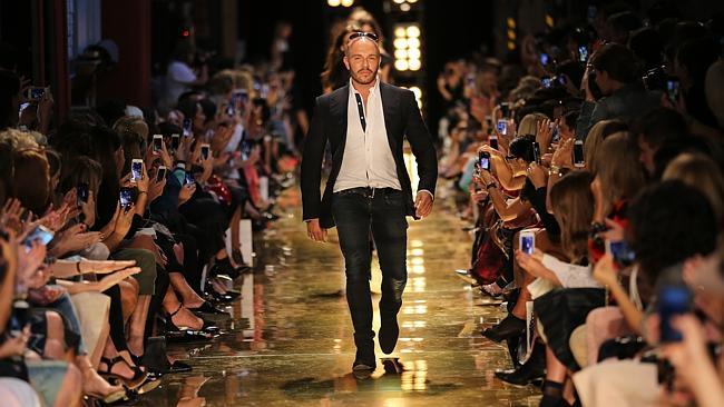 King of the catwalk: Alex Perry takes the applause. Picture: Attila Szilvasi