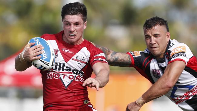 Redcliffe halfback Cory Paix (left) evades a tackle challenge during an Intrust Super Cup clash. Picture: AAP