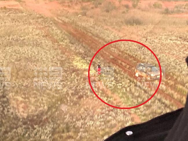 The family were waving their clothes in the air in an effort to get the attention of a rescue a helicopter. Picture: Supplied/Nine News