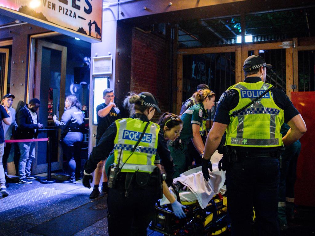 Police with paramedics in Hindley St just after midnight, New Year’s Day, 2020. Picture: AAP / Morgan Sette