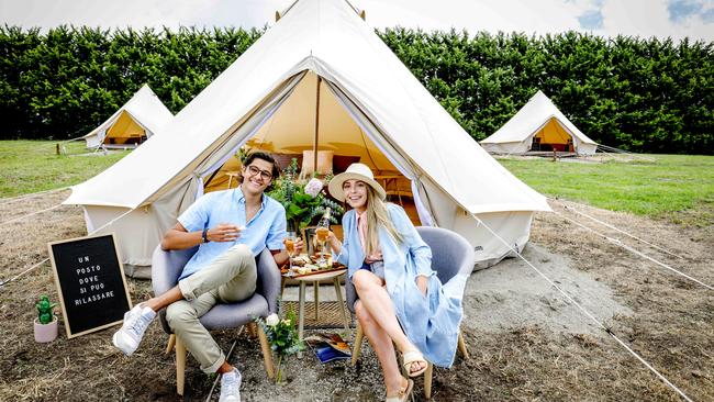 Go glamping on the Mornington Peninsula, at Blue Range Estate Wines. Damian Melone and Anna Goodrich enjoy some sparkles at the site. Picture: Nicole Cleary