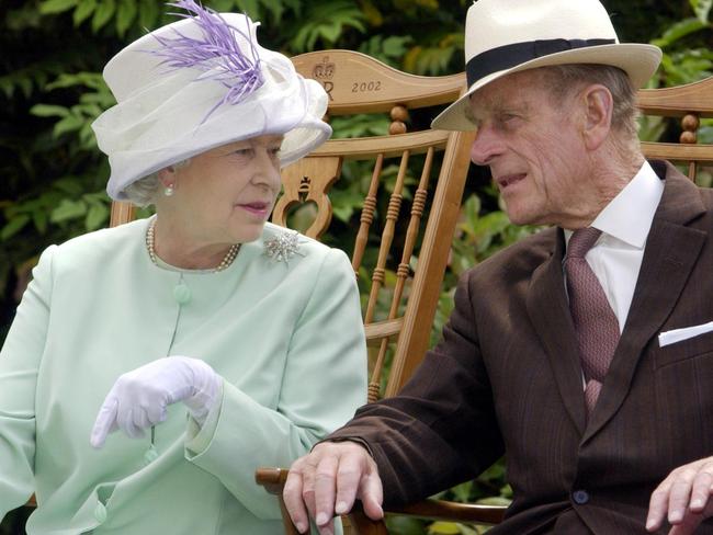 Britain's Queen Elizabeth II (L) and Britain's Prince Philip, Duke of Edinburgh (R) chat in 2002. Picture: AFP